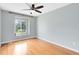 Bedroom with wood floors and a nice window at 15324 Black Lion Way, Winter Garden, FL 34787