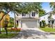 Charming two-story home with a well-maintained lawn and mature landscaping at 15324 Black Lion Way, Winter Garden, FL 34787