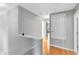 Upstairs hallway with hardwood floors, neutral paint, and access to bedrooms at 15324 Black Lion Way, Winter Garden, FL 34787