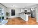 Modern kitchen featuring stainless steel appliances and a breakfast bar at 15324 Black Lion Way, Winter Garden, FL 34787