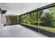 Spacious screened-in lanai with views of the green backyard at 15324 Black Lion Way, Winter Garden, FL 34787
