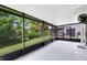 Large screened-in lanai overlooking the landscaped backyard at 15324 Black Lion Way, Winter Garden, FL 34787
