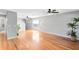 Spacious living room boasts hardwood floors, ample natural light, and ceiling fans at 15324 Black Lion Way, Winter Garden, FL 34787