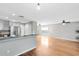 Open-concept living room features hardwood floors and recessed lighting at 15324 Black Lion Way, Winter Garden, FL 34787