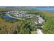 Aerial view of a residential community with homes nestled among lakes and lush foliage at 15483 Avenue Of The Arbors, Winter Garden, FL 34787