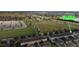 Aerial view of residential homes, green space, and parking in this community at 15483 Avenue Of The Arbors, Winter Garden, FL 34787