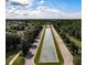 Striking aerial view of a community with a long water feature running through the center at 15483 Avenue Of The Arbors, Winter Garden, FL 34787