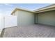 Paver patio in the backyard, enclosed with a white fence and a privacy wall at 15483 Avenue Of The Arbors, Winter Garden, FL 34787