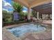 Inviting community hot tub with stone surround, lounge chairs and shade structure for relaxing and enjoying the outdoors at 15483 Avenue Of The Arbors, Winter Garden, FL 34787