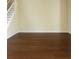 Empty living room space with new wood floors and natural light at 15483 Avenue Of The Arbors, Winter Garden, FL 34787