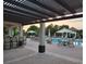 Community pool area with brick pavers, pergola, sun umbrellas and lounge seating at 15483 Avenue Of The Arbors, Winter Garden, FL 34787