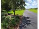 Scenic walking path lined with lush greenery, offering residents a peaceful and picturesque environment for recreation at 15483 Avenue Of The Arbors, Winter Garden, FL 34787