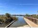 Beautiful waterfront view from the property, with serene water and lush vegetation at 15483 Avenue Of The Arbors, Winter Garden, FL 34787