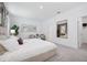 The main bedroom offers a neutral color scheme, natural light, and plush carpeting for a cozy atmosphere at 1802 Lattice Way, St Cloud, FL 34771
