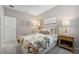 This bedroom features soothing neutral tones and tasteful decor for a tranquil retreat at 1802 Lattice Way, St Cloud, FL 34771