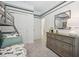 bedroom with striped accent walls, plush carpeting, and ample closet space for storage at 1802 Lattice Way, St Cloud, FL 34771
