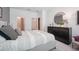 Comfortable bedroom featuring a luxurious bed, soft carpet, and a view of the ensuite bathroom at 1802 Lattice Way, St Cloud, FL 34771