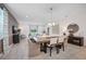 Inviting dining room open to living area, featuring a stylish table and seating for six at 1802 Lattice Way, St Cloud, FL 34771