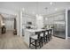Modern kitchen with a large island, stainless steel appliances, pendant lights, and gray cabinets at 1802 Lattice Way, St Cloud, FL 34771