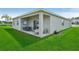 Covered patio with outdoor seating perfect for relaxing or entertaining in a private setting at 1802 Lattice Way, St Cloud, FL 34771