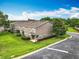 Aerial shot of the townhomes with lush landscaping, green lawns, and paved street at 2005 Compass Flower Way, Ocoee, FL 34761