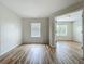 Spacious bedroom with wood-look flooring and plenty of natural light from the large window at 2005 Compass Flower Way, Ocoee, FL 34761