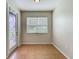 Versatile bonus room with tiled floor, window for natural light and door with decorative glass insert at 2005 Compass Flower Way, Ocoee, FL 34761