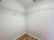 Walk-in closet with wooden-look flooring and wire shelving at 2005 Compass Flower Way, Ocoee, FL 34761