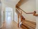 Entryway featuring a staircase with a wood railing and a view into the living area at 2005 Compass Flower Way, Ocoee, FL 34761