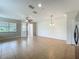 Spacious living area with tiled flooring, a ceiling fan, and ample natural light at 2005 Compass Flower Way, Ocoee, FL 34761