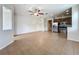 Open concept living area with tile flooring, ceiling fan, recessed lighting and kitchen at 2005 Compass Flower Way, Ocoee, FL 34761