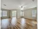 Spacious living room featuring laminate floors, neutral walls, and ample natural light at 2005 Compass Flower Way, Ocoee, FL 34761