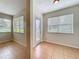 Bright living room featuring tile floors and large windows offering ample natural light at 2005 Compass Flower Way, Ocoee, FL 34761