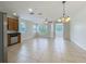 Open living space with tile flooring and natural light at 2005 Compass Flower Way, Ocoee, FL 34761