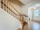 Beautiful staircase with wood treads and white risers leading to the upper level at 2005 Compass Flower Way, Ocoee, FL 34761