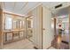 Bathroom featuring a large vanity mirror, cabinets, and an entrance into the shower at 2060 Lamplight Cir, Mount Dora, FL 32757