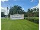 Welcome to Dora Pines, a 55+ resident-owned community, with a manicured lawn and mature trees at 2060 Lamplight Cir, Mount Dora, FL 32757