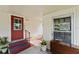 Covered entrance featuring a red door at 2060 Lamplight Cir, Mount Dora, FL 32757