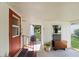 Covered entrance featuring a red door and porch at 2060 Lamplight Cir, Mount Dora, FL 32757