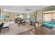 Bright living room featuring plush sofas and large windows at 2060 Lamplight Cir, Mount Dora, FL 32757