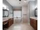 Luxurious bathroom with dual vanities, a soaking tub, and a separate walk-in shower at 2106 Ridgewind Way, Windermere, FL 34786