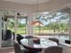 Bright dining area with access to pool and outdoor seating at 2106 Ridgewind Way, Windermere, FL 34786