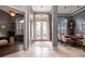 Welcoming foyer with decorative glass doors, neutral tones, and an open view into the dining area at 2106 Ridgewind Way, Windermere, FL 34786