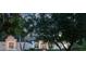 Elegant home exterior featuring stone accents, lush landscaping, and a well-maintained front yard at 2106 Ridgewind Way, Windermere, FL 34786