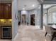 Spacious hallway featuring neutral color palette, tile flooring, and archways at 2106 Ridgewind Way, Windermere, FL 34786