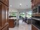 Modern kitchen with stainless steel appliances, granite countertops, and a large island at 2106 Ridgewind Way, Windermere, FL 34786