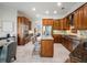 Gourmet kitchen featuring custom cabinetry, stainless steel appliances, and a center island with seating at 2106 Ridgewind Way, Windermere, FL 34786