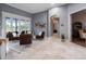 Living room with neutral color palette, tile flooring, and natural light at 2106 Ridgewind Way, Windermere, FL 34786