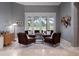 Cozy living room showcasing stylish decor, ample seating, and serene views of the outdoors at 2106 Ridgewind Way, Windermere, FL 34786
