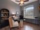 Inviting office with natural light, built-in shelving and hardwood flooring at 2106 Ridgewind Way, Windermere, FL 34786